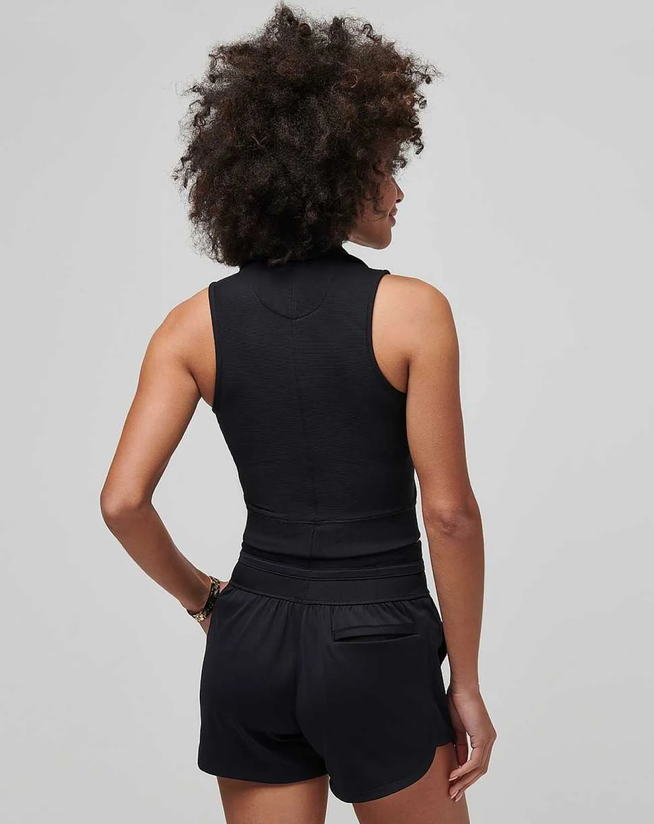 TravisMathew Polos>Moveknit Sleeveless Vneck Polo