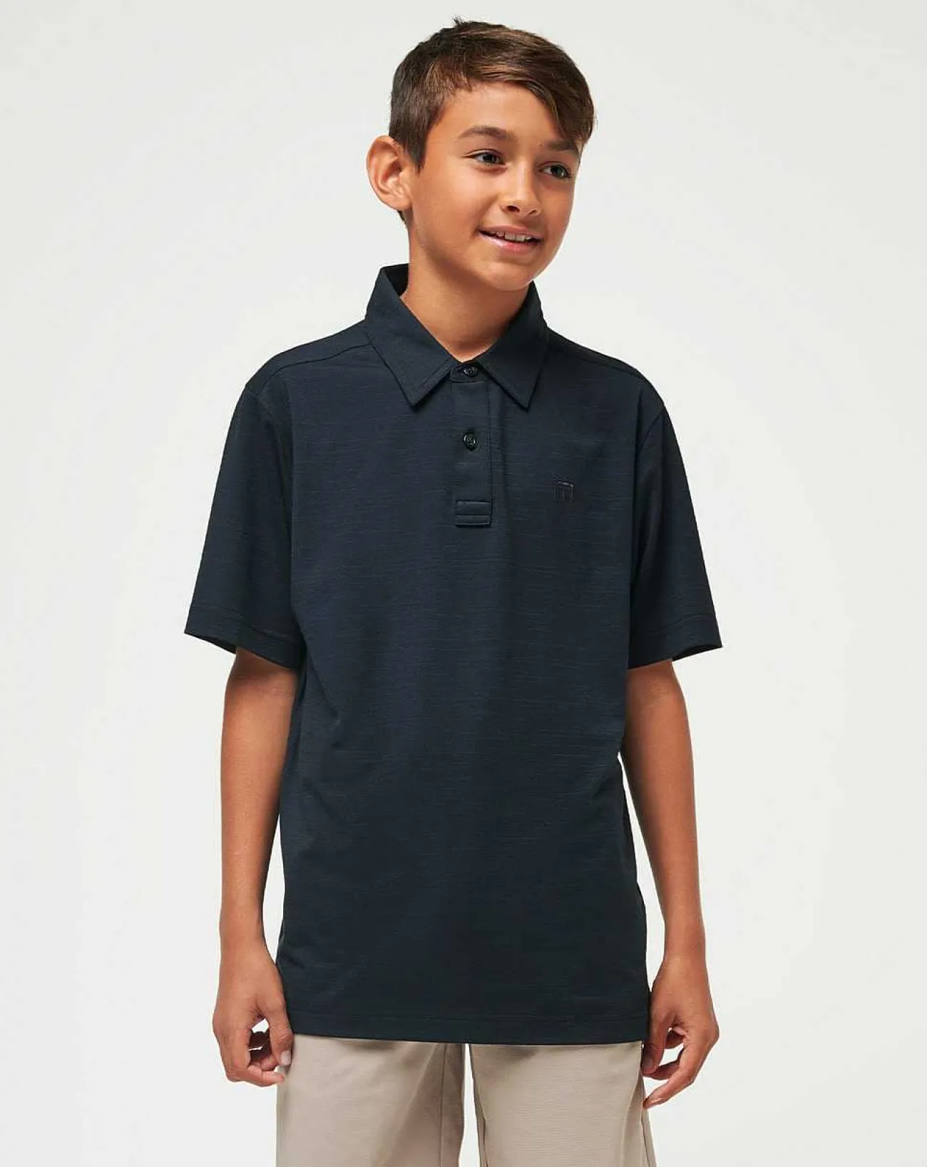 TravisMathew Youth Tops>The Heater Youth Polo